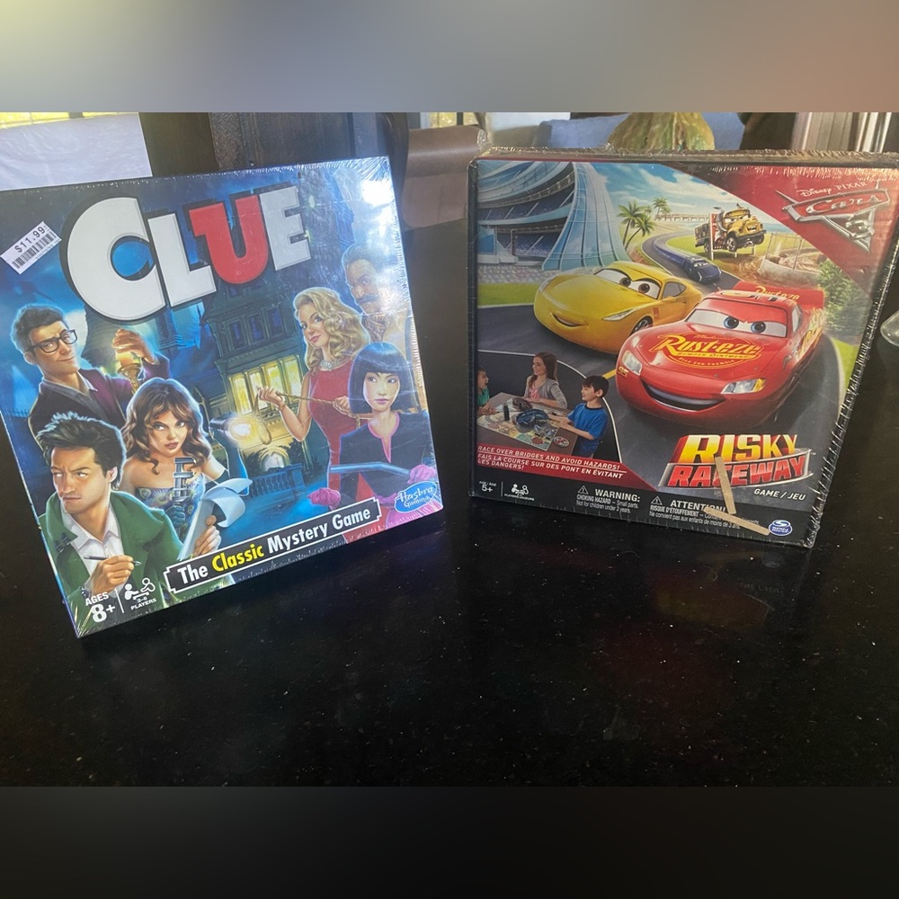2 Games Clue: The Classic Mystery Game:
Disney Cars 3: Risky Raceway Board Game: